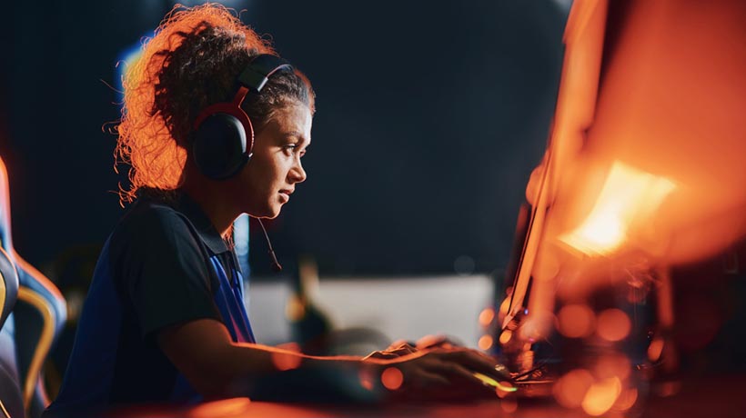 A young woman participates in a video game competition